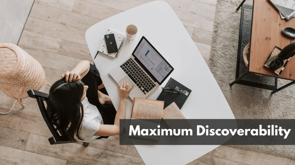 lady using laptop at table in modern workspace