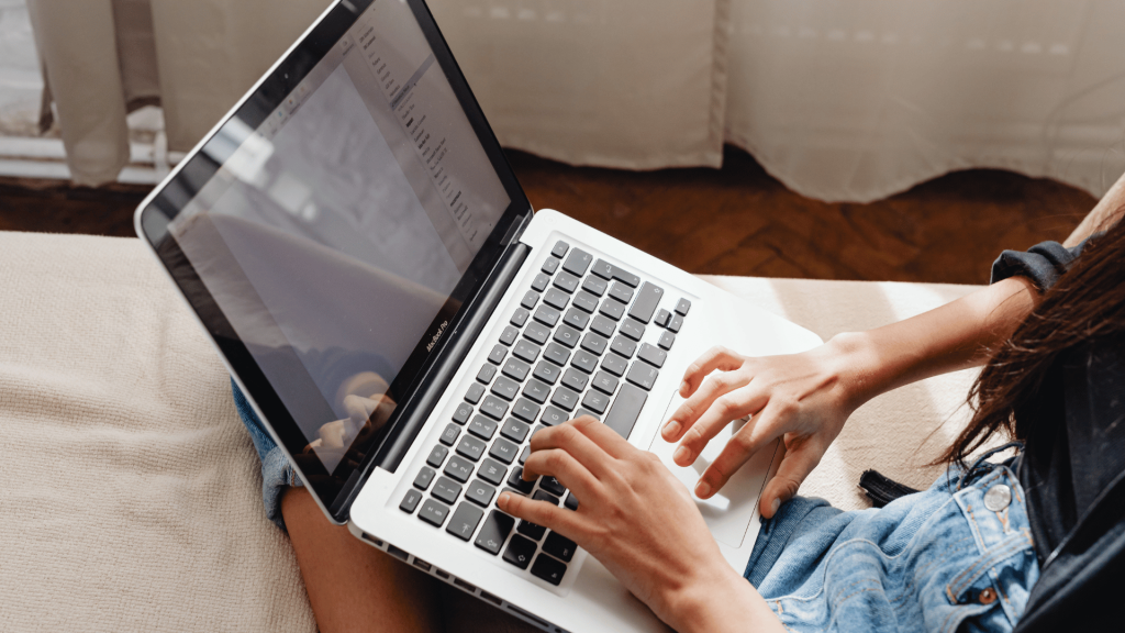 Person Browsing on a Laptop Computer