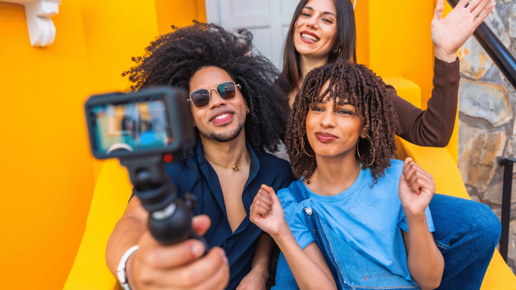 Content creators filming a video blog with action camera