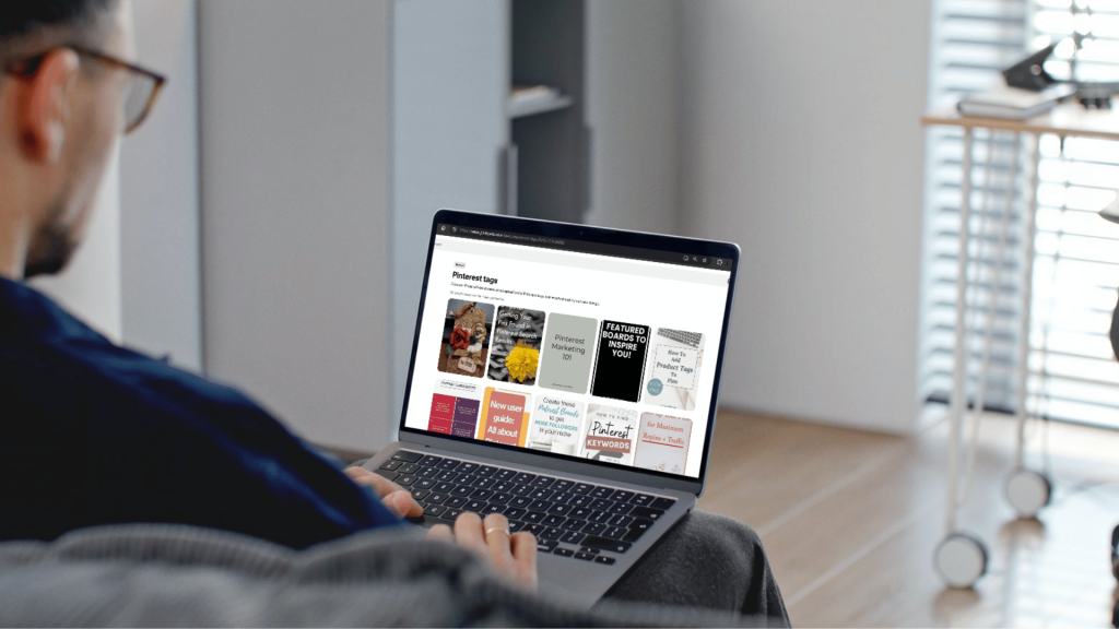 A man working in his laptop that is sitting on top of his lap. 