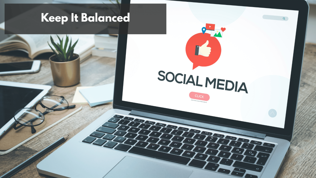 A laptop and a bunch of smart phone on top of a wooden table