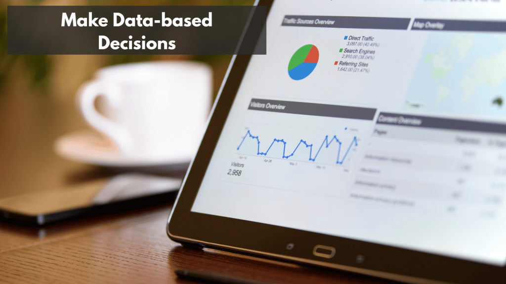 A tablet and a mobile phone on top of a wooden desk