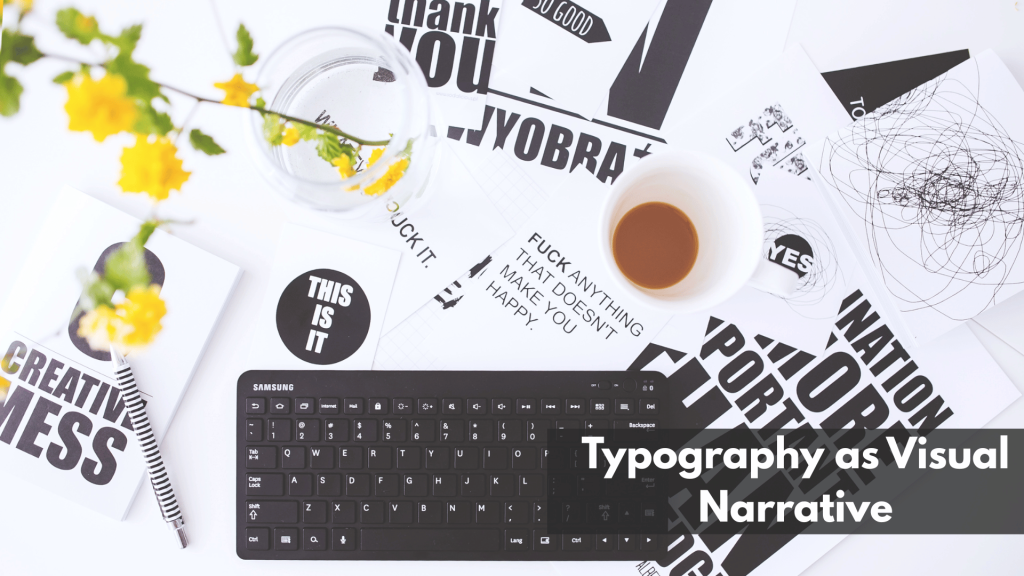 Flat lay of creative workspace with bold black-and-white typography prints, keyboard, coffee cup, and yellow flowers—demonstrating typography as a form of visual storytelling.