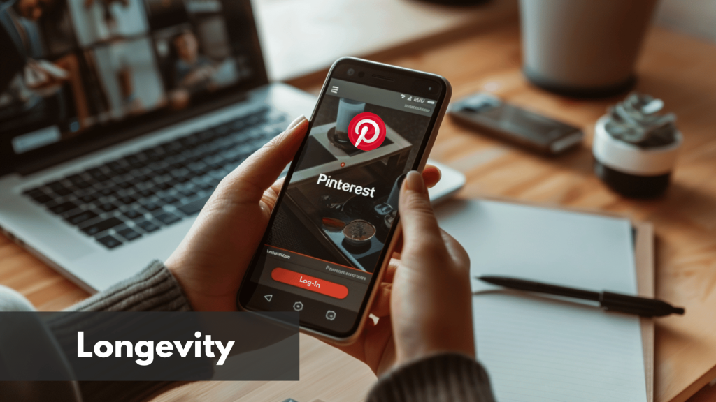 A man holding his phone while trying to login to Pinterest