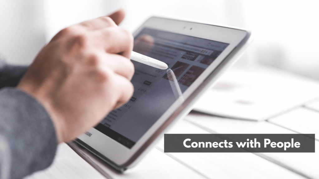 A man holding a table while using his stylus pen