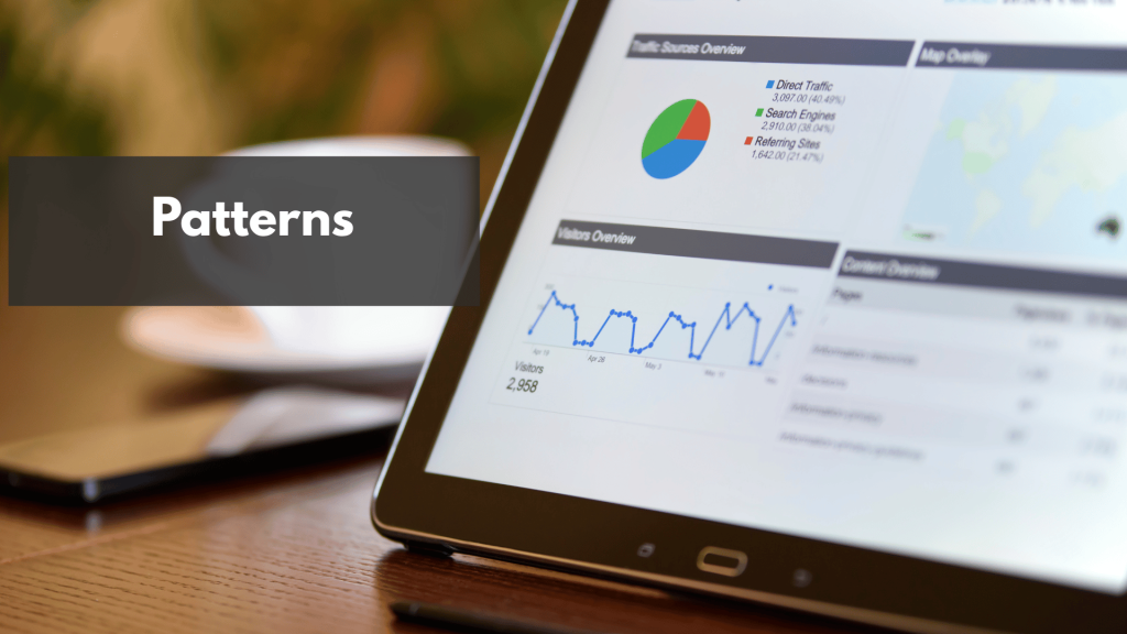 A tablet sitting on top of a wooden desk