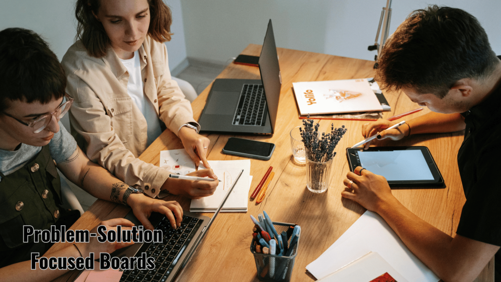 Team brainstorming Pinterest strategy with text overlay 'Problem-Solution Focused Boards' at modern workspace.